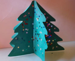 Árbol de Navidad en 3D. Manualidades infantiles con cartulina